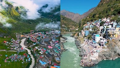 Colourful village nestled in a mountainous landscape with a river flowing through.