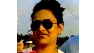 A photo of Vishakha Rathod wearing dark sunglasses and a white top outdoors.