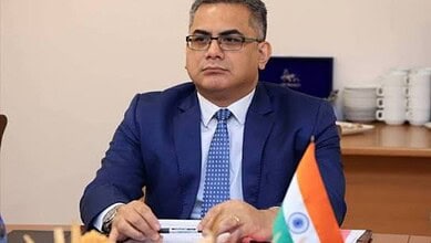 Indian diplomat Vishwesh Negi seated during an official meeting.