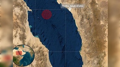 Tanker on fire off Saudi Arabia after projectile strike, with visible flames and smoke.