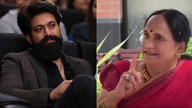 A man with a beard and a woman in a red saree engaged in a serious conversation.