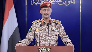 Houthi military spokesman Yahya Saree speaking at a press conference.