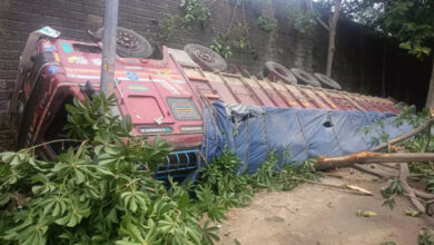 Lorry carrying cement bags falls from ORR in Shamshabad
