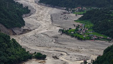 A view of damaged and half-buried buildings under silt and debris following devastating flash floods, at Betrawati market, in Nuwakot district, Nepal, Wednesday, Sept. 2, 2026.