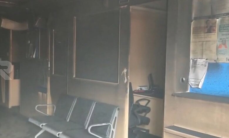 Inside HDFC bank showing burnt furniture and damaged interior after fire.