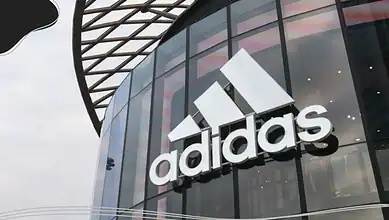 Adidas logo on a store exterior.