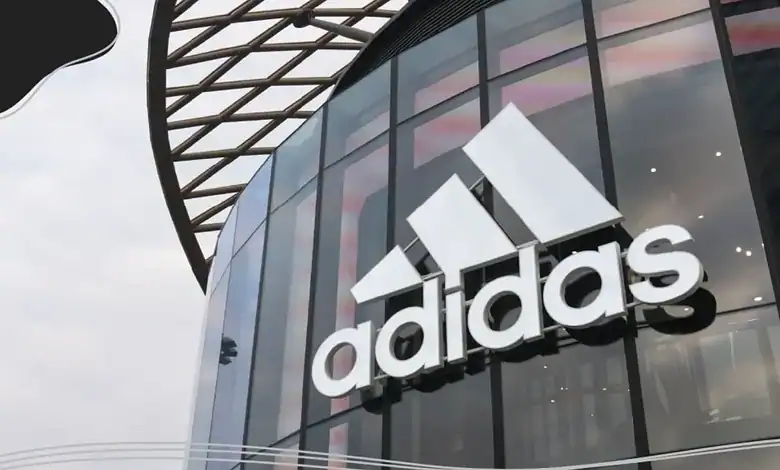 Adidas logo on a store exterior.