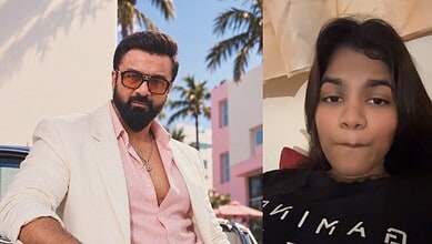 Ajaz Khan and influencer taking a selfie, outdoor setting with palm trees.
