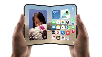 Foldable iPhone with a 7.6-inch screen and Touch ID displayed in a person's hands.