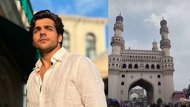 Ashish Chanchlani standing near Charminar in Hyderabad, India, during daytime.