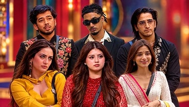 Group of Bigg Boss contestants posing together in colourful outfits.
