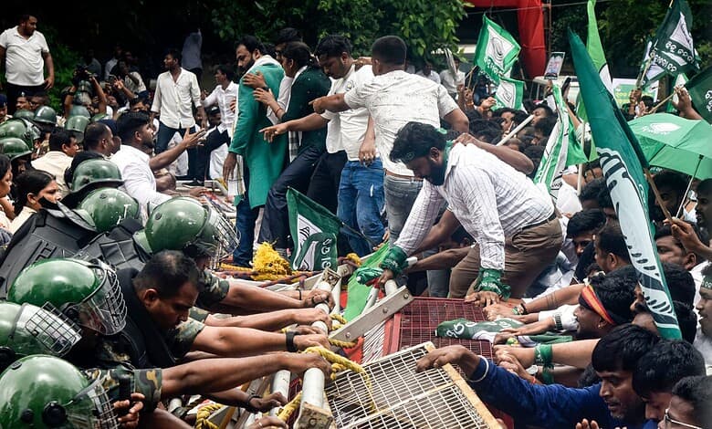 Bhubaneswar: Security personnel stop Biju Janata Dal (BJD) youth and student wing members during a protest over alleged errors in school textbooks, demanding the resignation of state School and Mass Education Minister Nityananda Gond, in Bhubaneswar, Odisha, Wednesday, Sept. 23, 2026. (PTI Photo)