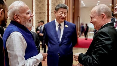 Prime Minister Narendra Modi with Russian President Vladimir Putin and Chinese President Xi Jinping on the sidelines of the 18th BRICS Summit, in New Delhi. (Source: PTI)