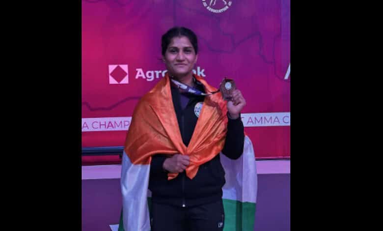 Suchika Tariyal with her medal at the Asian Games, draped in the Indian flag.