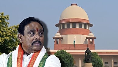 Indian politician in traditional attire outside the Supreme Court of India building.