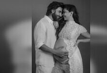 Deepika Padukone and Ranveer Singh with her pregnant belly, smiling and embracing each other.