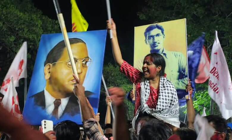 Young girl protesting with flags and portraits during HCU elections rally.