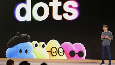 A presenter discusses Dots AI agents with a colourful animated display behind him.
