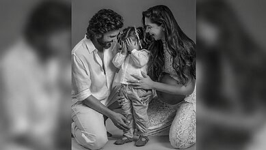 Family with daughter Dua, emotional moment, black and white photo.