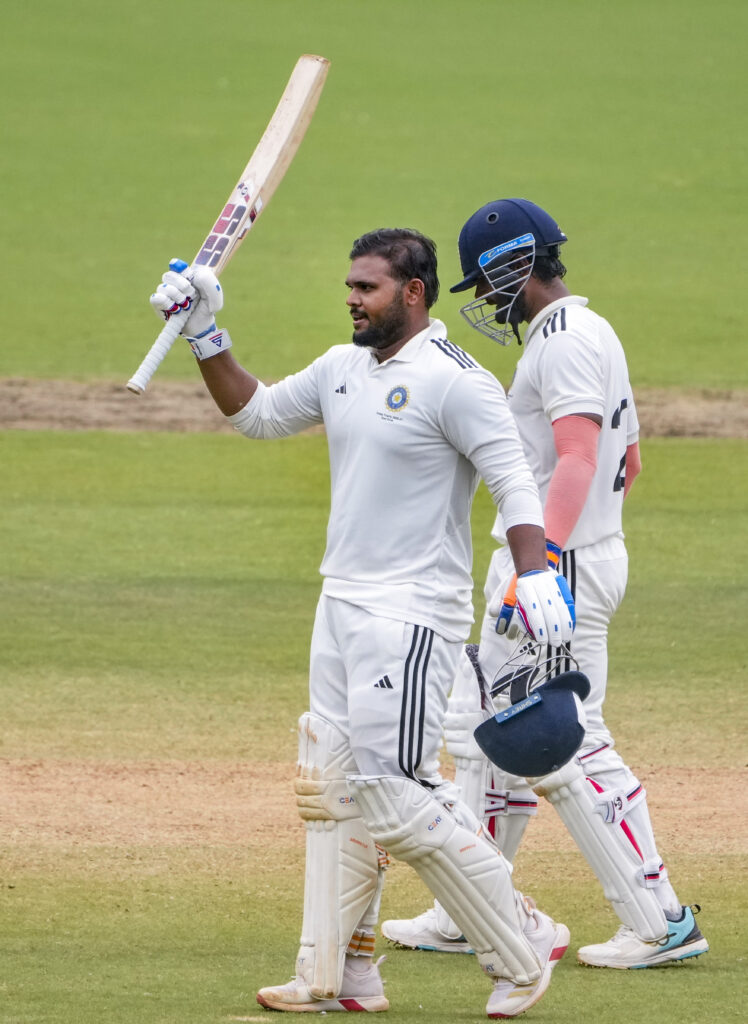 Indian cricketers celebrate on the field after a Duleep Trophy match victory.