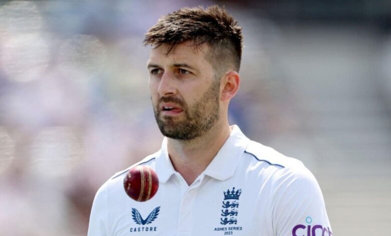 England cricketer Mark Wood in white uniform during a match.