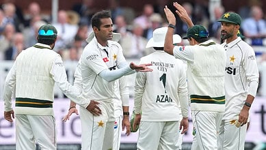 Pakistani cricket team players on the field during a match at Lord's.
