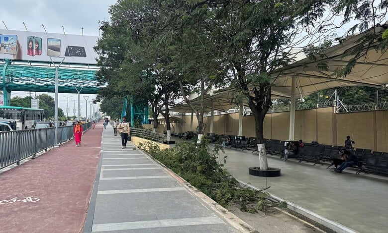 Hyderabad's well-maintained footpath in Hitech City with trees and seating areas.