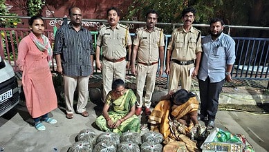 Police officers and women with seized ganja in Hyderabad, India.