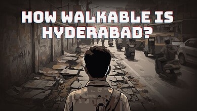Pedestrian walking on a damaged sidewalk in Hyderabad, highlighting walkability issues.