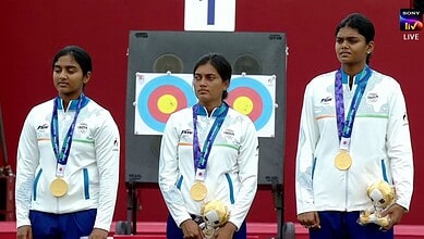Indian women's archery team wins gold at Asian Games with medals and teddy bears.
