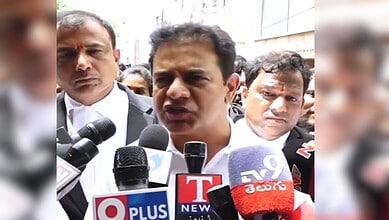 KTR speaking to media with microphones during a public event in Hyderabad.
