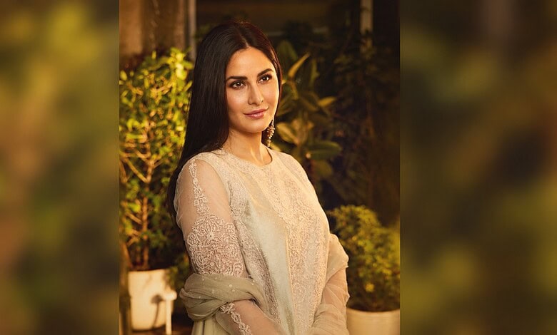 Katrina Kaif with long dark hair and elegant attire at an outdoor event.