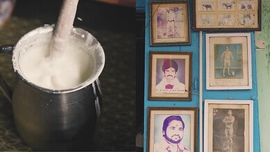 A traditional Indian milk shop with framed photographs on the wall in Hyderabad's Begum Bazar.