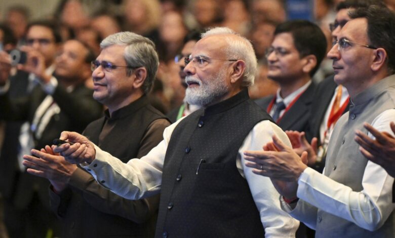 Prime Minister Narendra Modi at a formal event with officials and delegates.