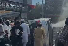 Bystanders try to help the accident victim in Hyderabad