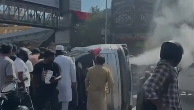 Bystanders try to help the accident victim in Hyderabad
