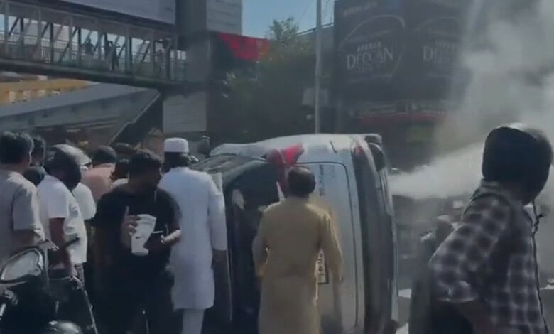 Bystanders try to help the accident victim in Hyderabad