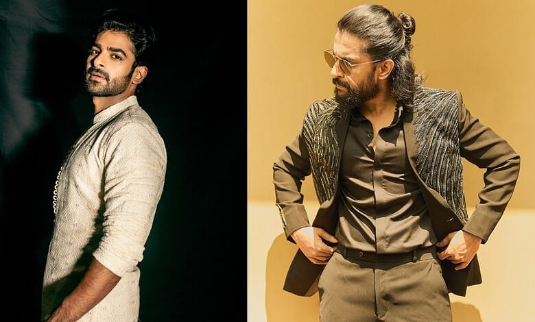 Two men in stylish outfits, one with a beard and the other with glasses and a bun hairstyle.