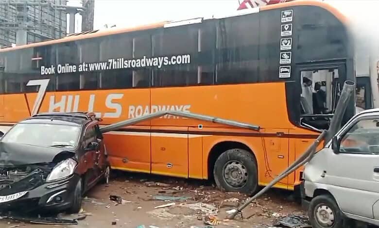 Bus crashes into hotel, causing damage to nearby vehicles and street debris in Shamshabad.