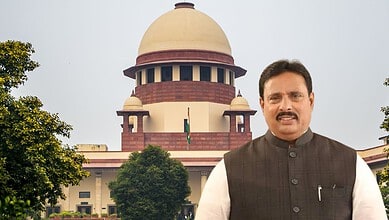 Indian politician standing outside the Supreme Court building in India.