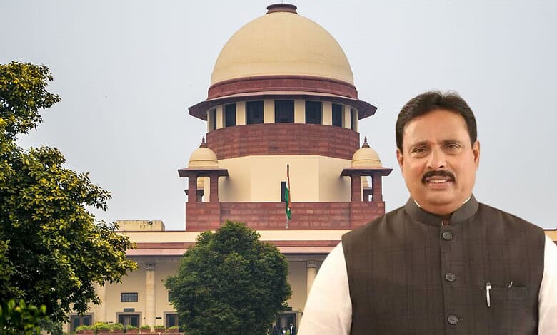 Indian politician standing outside the Supreme Court building in India.