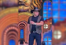 Salman Khan on Bigg Boss 20 set wearing a hat and casual attire, looking surprised.
