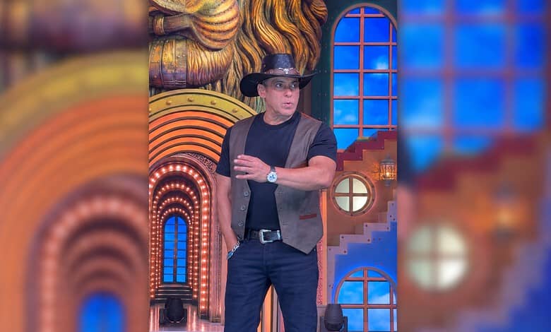 Salman Khan on Bigg Boss 20 set wearing a hat and casual attire, looking surprised.