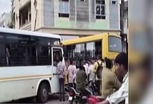 Crowd gathers around a bus after a collision with a school bus in Sircilla, two children injured.