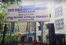 Signboard of Telangana State Human Rights Commission Hyderabad in English and Telugu.