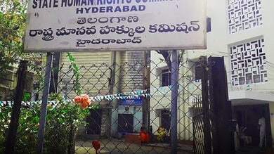 Signboard of Telangana State Human Rights Commission Hyderabad in English and Telugu.