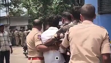 Police detain a man near Ramanthapur Polytechnic College in Hyderabad.