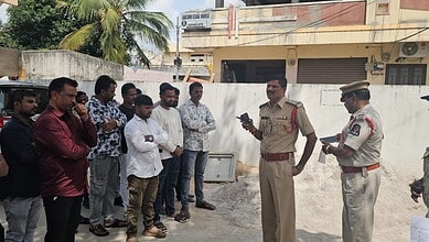 Police officers and community members gathered for a meeting in Attapur, Hyderabad.
