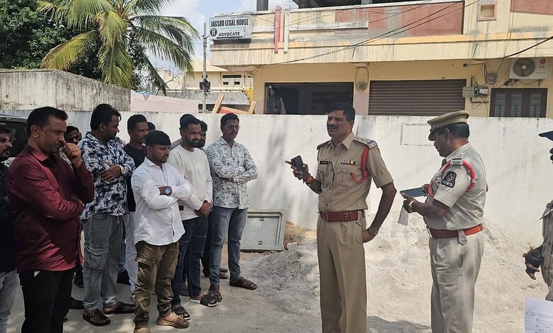 Police officers and community members gathered for a meeting in Attapur, Hyderabad.