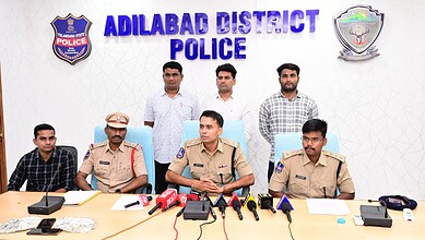 Adilabad District Police officers at a press conference on cyber fraud bust.